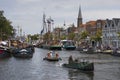 Leiden, Netherlands - July 28, 2018: Historical opduwers or opdrukkers, small tug- or towboats, on the canal during Sail Leiden 2