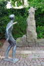 Leipzig, Germany - April 21, 2024: Approach, a bronze boy and granite female torso by Markus Glaeser in the sculpture garden in Royalty Free Stock Photo