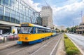 Leipzig, Germany - June 25, 2022: Leipzig tram at the Augustusplatz stop. Old tram in the city colors blue and yellow stops at a