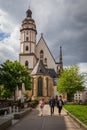 Leipzig Germany - May 3 2019: Tourists walk near the famous Thomaskirche where composer Johann Sebastian Bach was a