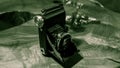 Old scratched and dusty antique photo camera, with foldable original Carl Zeiss Lens, on a rustic wooden table.