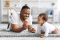 Leisure With Babies. Happy Black Dad Playing Toys With His Infant Child Royalty Free Stock Photo
