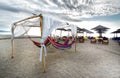 Leisure bed hanging bed and umbrella on tropical beach Royalty Free Stock Photo