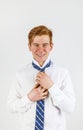 Leisure cool smart boy binding his tie Royalty Free Stock Photo