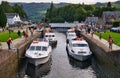 Leisure cruiser boats pass through the staircase locks at Fort Augustus in the Great Glen, Scotland, UK Royalty Free Stock Photo