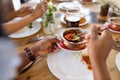 African man eating with friends at restaurant Royalty Free Stock Photo