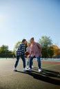 Group of friends bonding outdoors to play street basketball. Teens wearing casual style clothes. Kids look happy Royalty Free Stock Photo