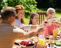 Happy family having dinner or summer garden party Royalty Free Stock Photo