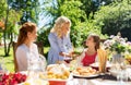 Happy family having dinner at summer garden Royalty Free Stock Photo