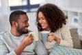 African american couple drinking coffee at home