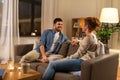 Happy couple talking at home in evening Royalty Free Stock Photo