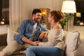 Happy couple talking at home in evening Royalty Free Stock Photo