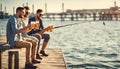 leisure and people concept - male friends fishing drinking beer on sea pier