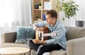Young man with guitar and music book at home Royalty Free Stock Photo
