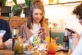 Friends with smartphones eating at restaurant Royalty Free Stock Photo