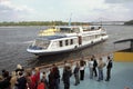 A leisure river boat sails along the main river of Ukraine - the Dnieper.