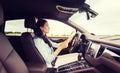 Happy woman driving car with smarhphone Royalty Free Stock Photo