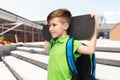 happy student boy with backpack and skateboard Royalty Free Stock Photo