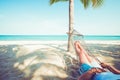 Relax and sunbathe on hammock at sandy tropical beach Royalty Free Stock Photo