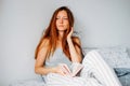 Leisure time activity. Young woman reading in bed Royalty Free Stock Photo