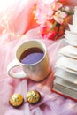 Leisure time for a cup of tea with sweets and book Royalty Free Stock Photo