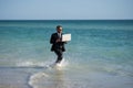 Leisure weekend and remote freelance work. Crazy comic business man in suit rest on sea bech. Funny businessman with Royalty Free Stock Photo