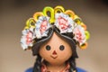 Lele doll with flower bows with skulls, traditional Mexican crafts made of clay Royalty Free Stock Photo