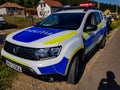 New Dacia Duster police car near roadside.