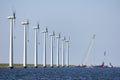 Crane ship busy with demolition offshore wind turbine farm Royalty Free Stock Photo