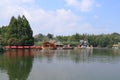 Landscape view with big pond, trees, blue sky at Floating Market, Lembang, Bandung, Indonesia