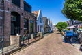 Lemmer, Netherlands - August 12, 2022: Street with small houses in the city of Lemmer in Friesland, Netherlands