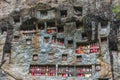 Lemo Tana Toraja, South Sulawesi, Indonesia, famous burial site with coffins placed in caves carved into the rock, guarded by ba Royalty Free Stock Photo