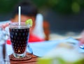 Lemon black tea in tall glass on table with copy space Royalty Free Stock Photo