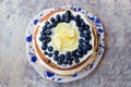 Lemon blueberry naked cake with blueberries on the top and mascarpone butter frosting Royalty Free Stock Photo