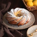 Lemon bundt cake powdered sugar on wooden table Royalty Free Stock Photo