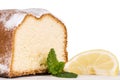 Lemon cake decorated with a lemon fruit, isolated on white Royalty Free Stock Photo