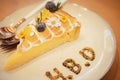 Lemon cheesecake one piece with message of H.B.D, Happy Birthday one year anniversary