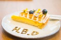 Lemon cheesecake one piece with message of H.B.D, Happy Birthday one year anniversary