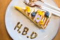 Lemon cheesecake one piece with message of H.B.D, Happy Birthday one year anniversary