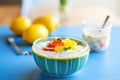 lemon chia pudding with lemon zest in a blue bowl