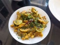 Lemon chicken served in a white plate