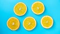 Lemon circles on blue background. Royalty Free Stock Photo