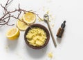Lemon, coffee anti-cellulite scrub with natural ingredients, sea salt on a light background, top view. Skin care concept