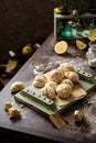 Lemon cookies with powdered sugar on green wooden board Royalty Free Stock Photo