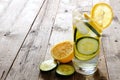 Lemon cucumber detox water in a glass over rustic wood