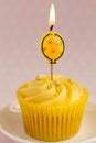 Lemon cupcake with butter cream swirl and balloon candle