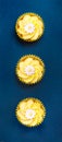 Lemon cupcakes with butter cream swirl and candy daisy flower decorations Royalty Free Stock Photo