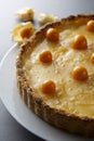 Lemon curd pie. Homemade delicious pie ,tart filled with lemon curd. Sweet dessert. Lemon curd pie decorated with physalis