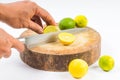 Lemon cut half by hand on round shopping board white background Royalty Free Stock Photo