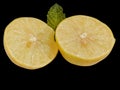 Lemon cut in two halves in black background Royalty Free Stock Photo